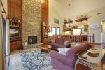 Custom wood shelving and paneling beautify the living space.